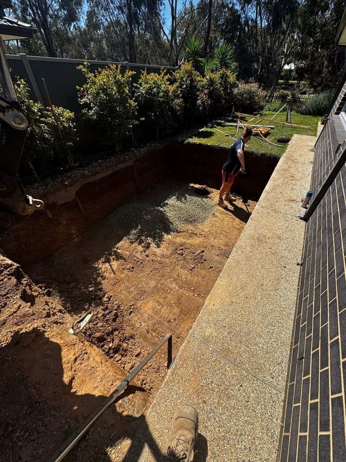 Excavation work receiving its final hand-finished detail