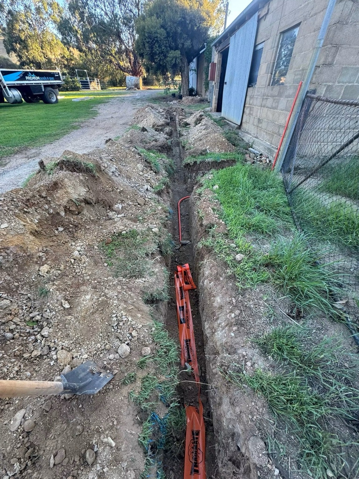 Freshly excavated trench through a residential site